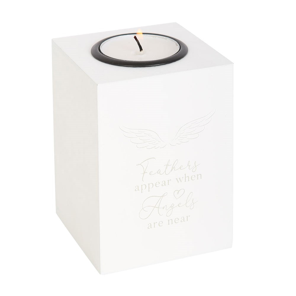 Feathers appear when angels are near tealight holder