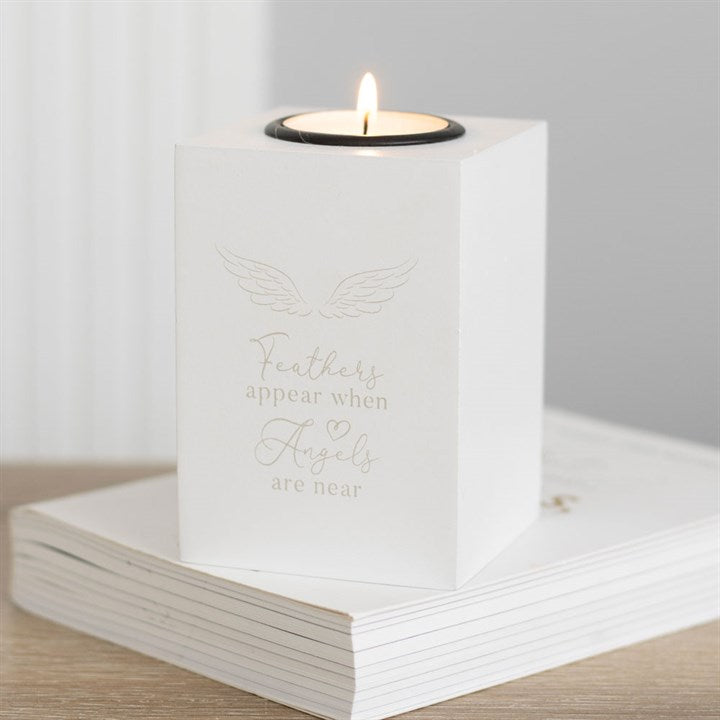 Feathers appear when angels are near tealight holder