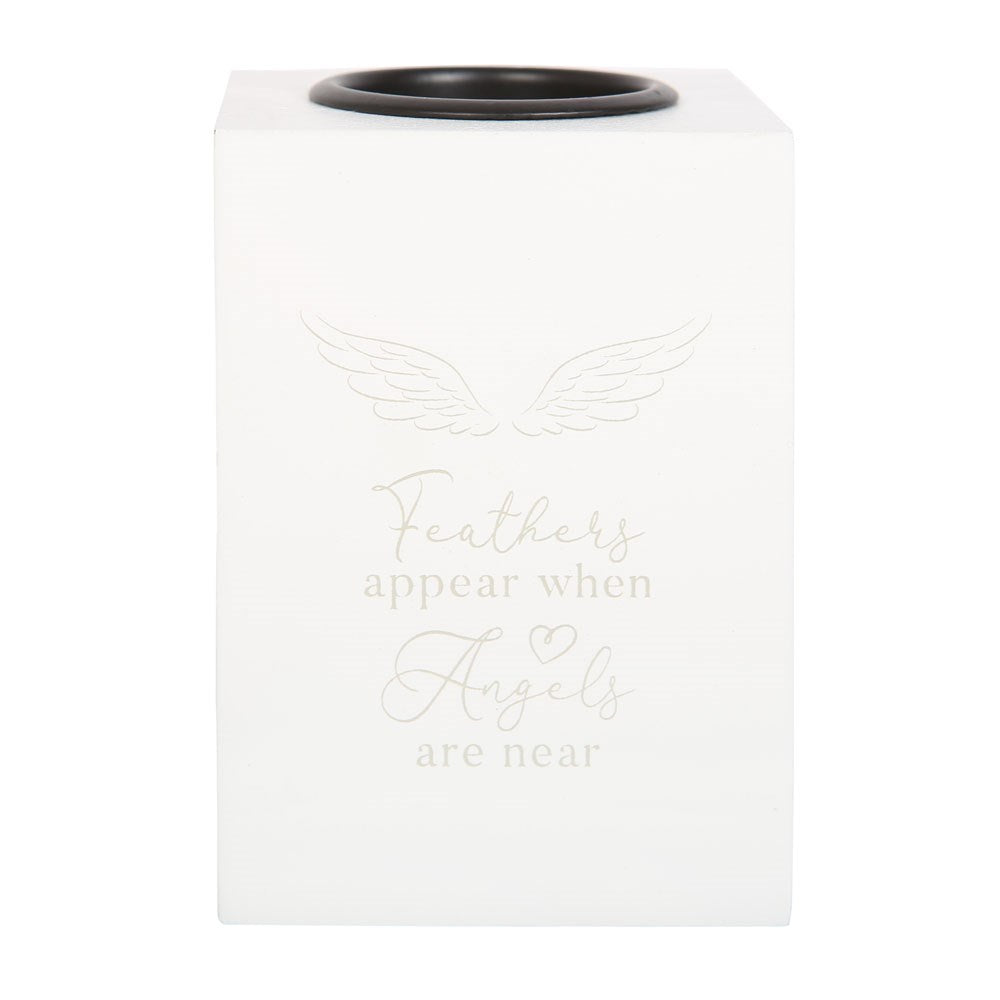 Feathers appear when angels are near tealight holder